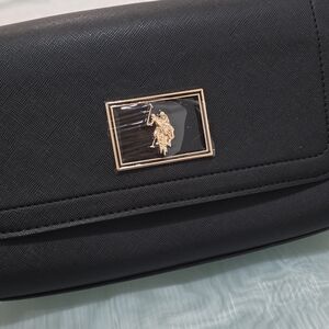 U.S. Polo Assn. Elegant Black Wristlet with Gold Accent